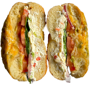 Fat Bagels sandwich with delicious fillings, cut in half.